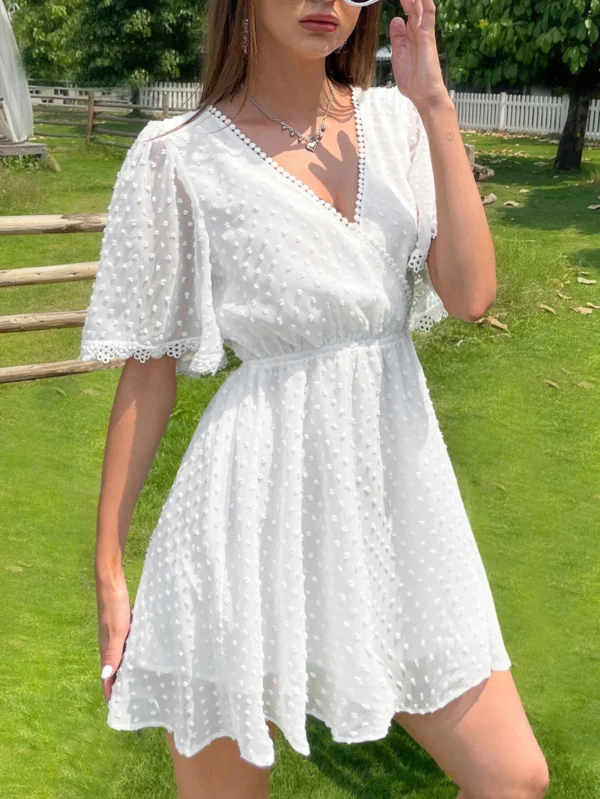 Vestido de lunares escote cruzado de manga con volante - Imagen 3