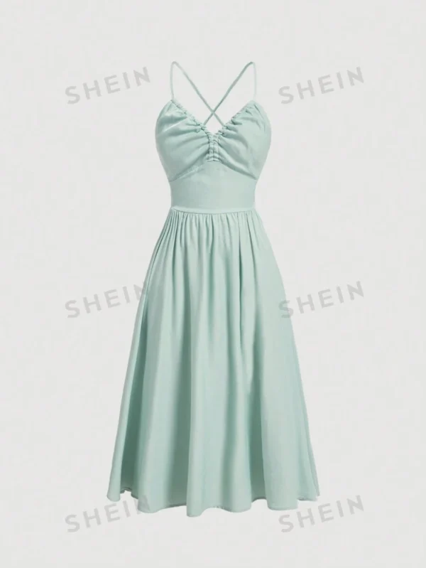 Vestido halter sin espalda de denim azul con lazo en la espalda