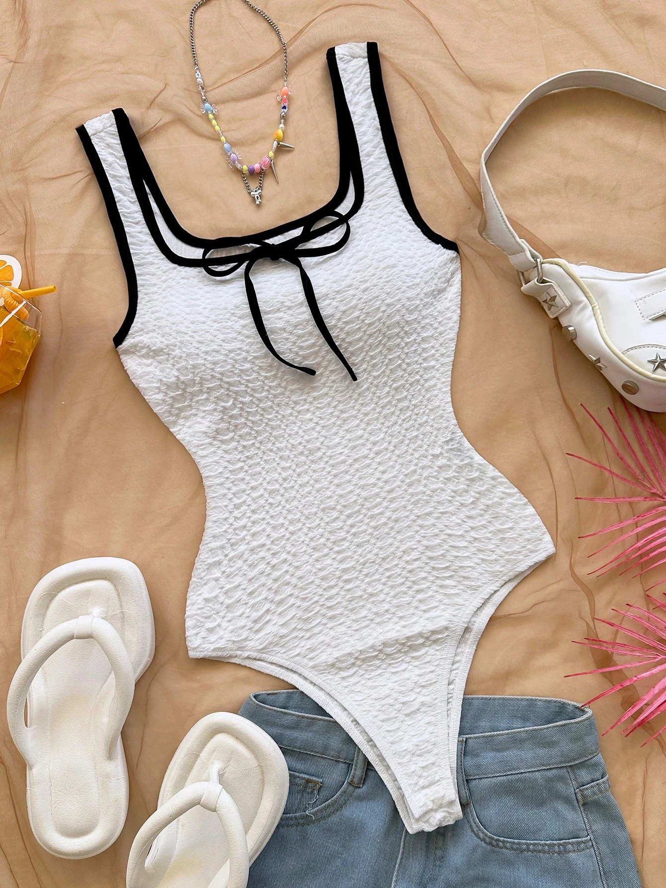 Body de mujer con lazo de punto