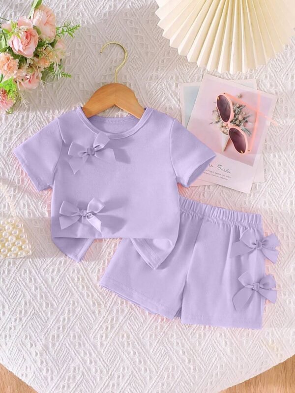 Conjunto de camiseta rosa con decoración de lazo Y pantalones cortos