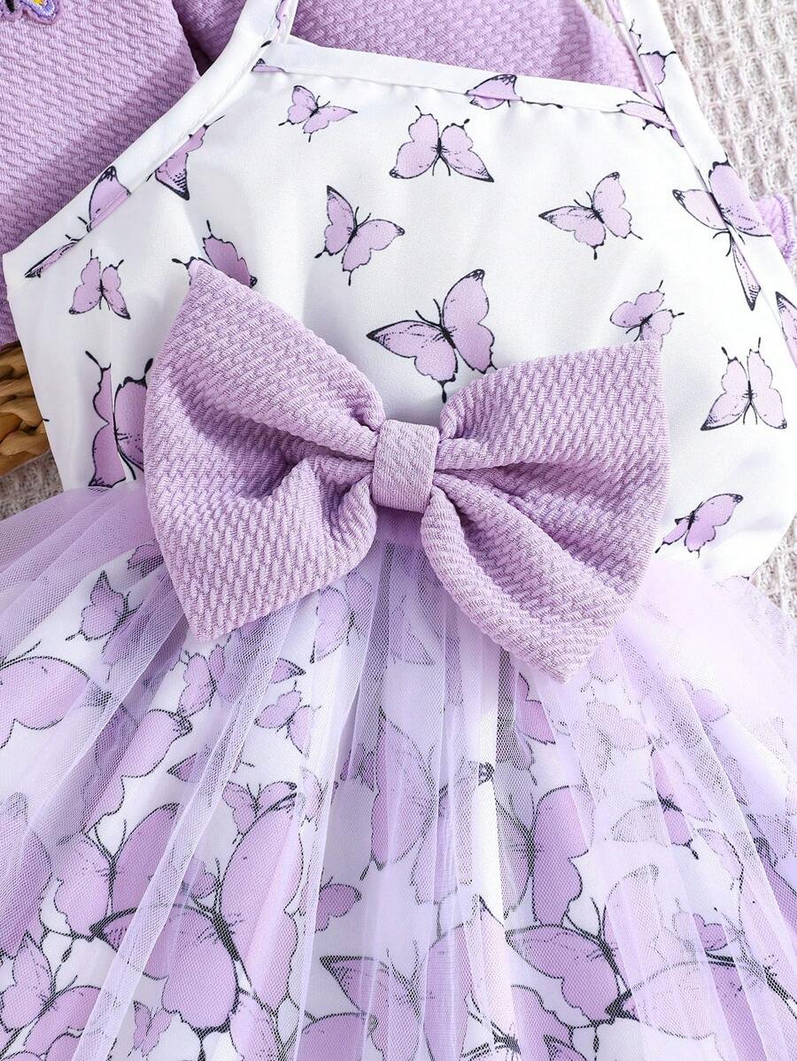 Chaqueta de manga larga con bordado de corazón con un vestido minimalista de malla - Imagen 3