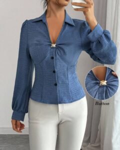 Blusa elegante de manga larga de unicolor con diseño metálico