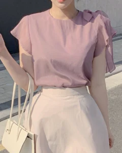 Blusa de mujer con manga corta, volantes y moño delantero