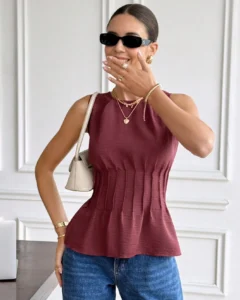 Blusa sin mangas de cuello redondo y cintura ceñida de unicolor