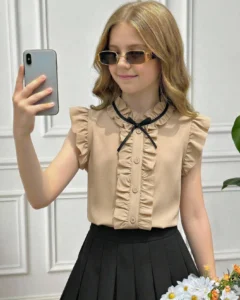Blusa de estilo vintage con cuello redondo, sin mangas y volantes