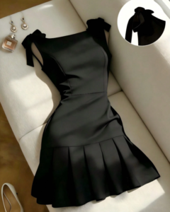 Vestido negro elegante con diseño de volantes y lazo