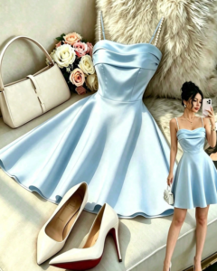 Vestido elegante y versátil sin mangas de tela brillante